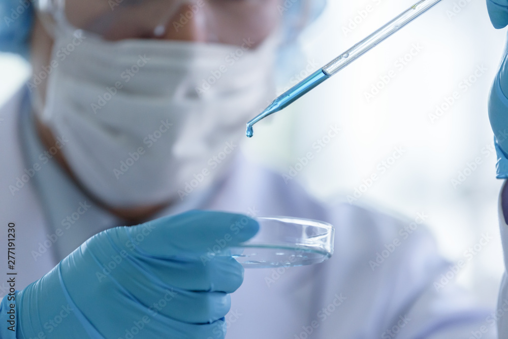 Asian senior scientist male researching and learning in a laboratory. Asian senior scientist male researching and learning in a laboratory.