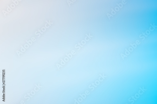 Abstract blue and white gradient background. Blurry defocused natural backdrop with bokeh lights. Soft summer, spring vibrant color and smooth wallpaper. Horizontal peaceful decorative image