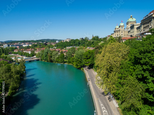 Bern, Switzerland - Jun 1st 2019: .The Aare river flows around three sides of the city of Bern. With its crystal-clear turquoise water