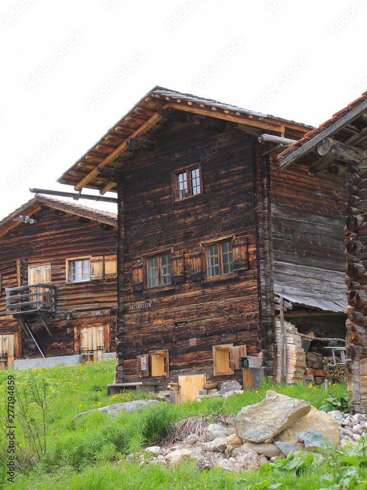 Old timber houses in Obermutten, Canton of Grisons, Switzerland.