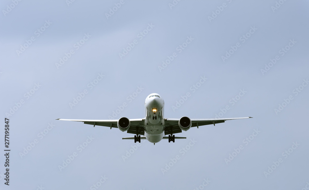 air plane in the blue sky front closeup view air plane in the blue sky front closeup view