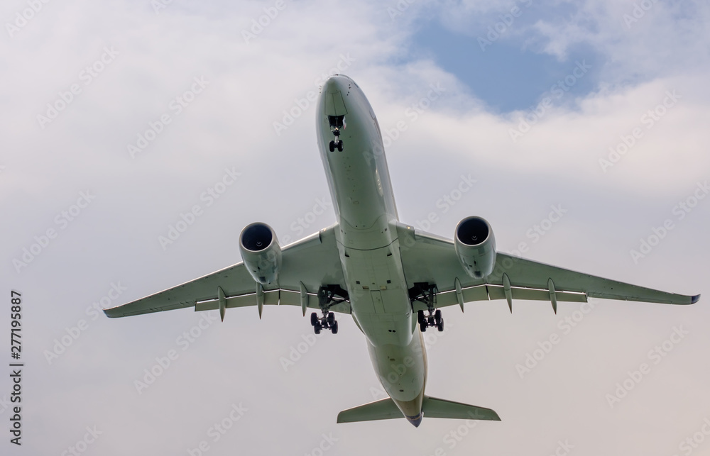 air plane in the blue sky front closeup view