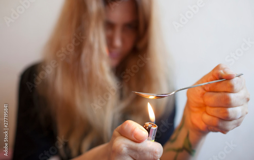 Portrait of a woman preparing drugs
