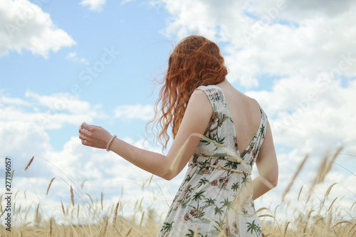 redhead girl in wheat field