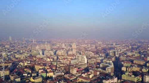 Wallpaper Mural Aerial drone footage view of famous statue on cathedral Duomo in Milan Italy // no video editing Torontodigital.ca