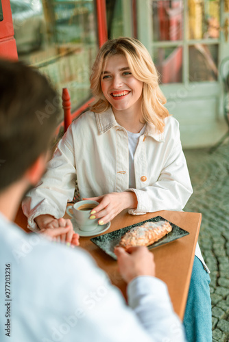 Charming young lady enjoying meeting with boyfriend