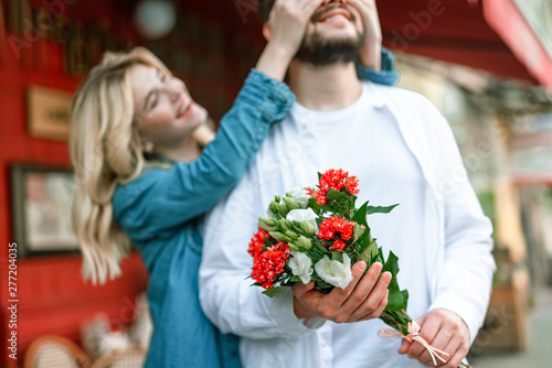 Smiling woman having fun with her boyfriend near cafe © Yakobchuk Olena
