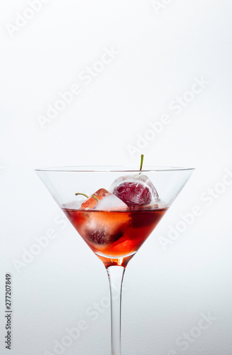 red cocktail with cherries