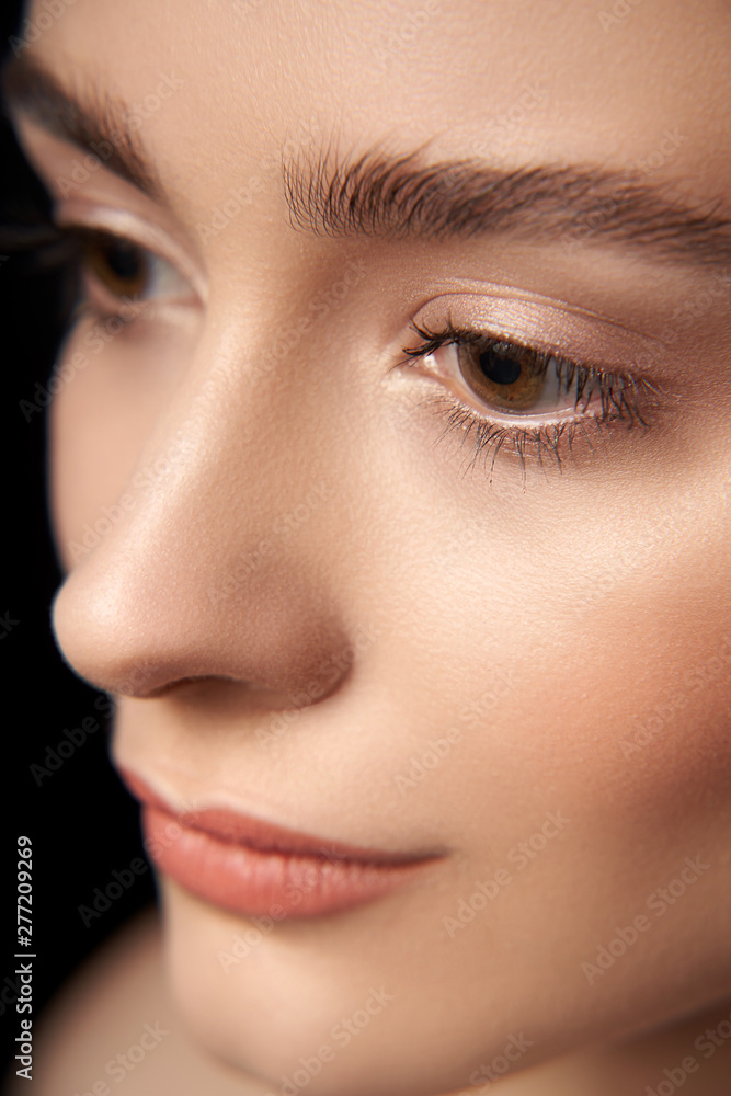 Naklejka premium Calm woman posing on black background in studio