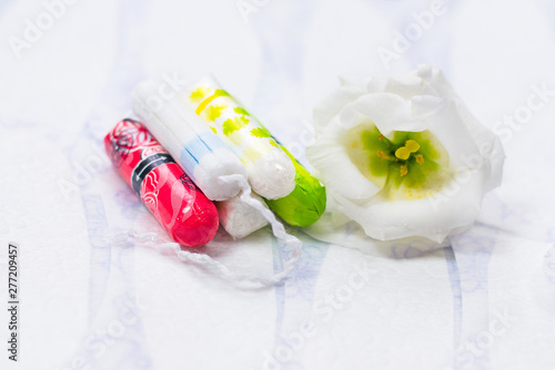 Hygienic white tampon for women. Cotton swab. Menstruation, means of protection. 