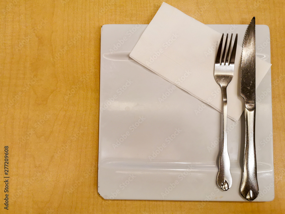 knife and fork on napkin knife and fork on napkin
