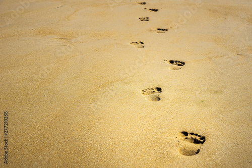 Footprints in the sand with copy space. photo