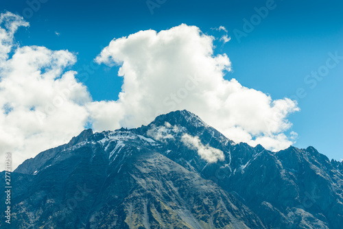 high mountain peaks and clouds, a beautiful mountain landscape on a sunny day. Caucasus, Georgia © kosmos111