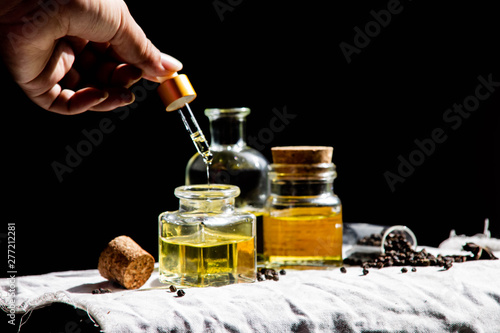 Pure black pepper essential oil by hand dripping - a concept for good health