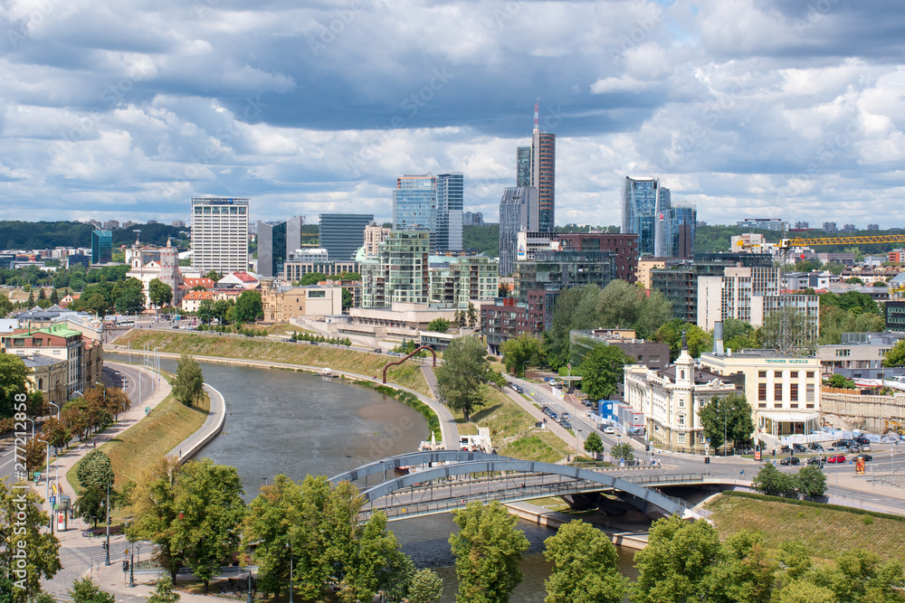 Vilnius, capital of Lithuania, scenic aerial panorama of modern business financial district architecture buildings with river and bridge 