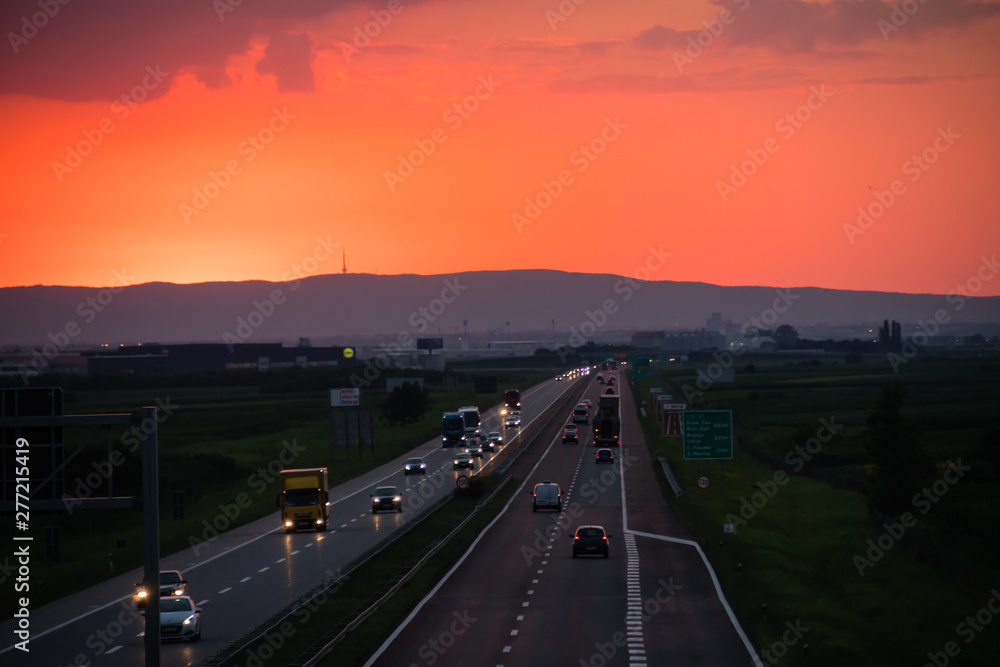 Sunset on the highway with traffic