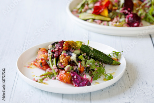 Bulgur wheat salad with roast beetroots, carrots, zucchini and green peas