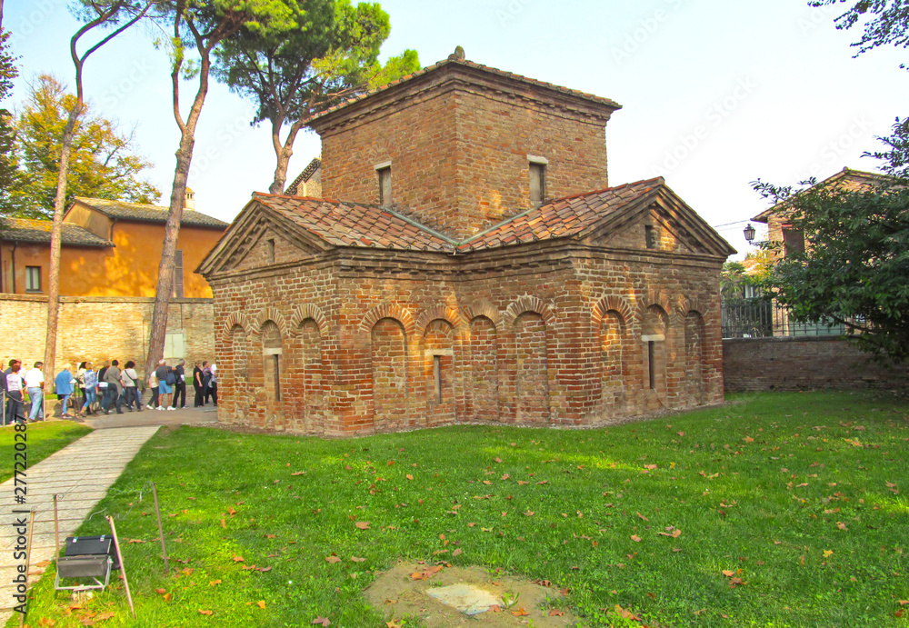 RAVENNA, ITALY - NOVEMBER 21, 2012 The Mausoleum of Galla Placida in Ravenna, Italy. Small chapel with colorful Byzantine mosaics - one of the UNESCO world heritage site.