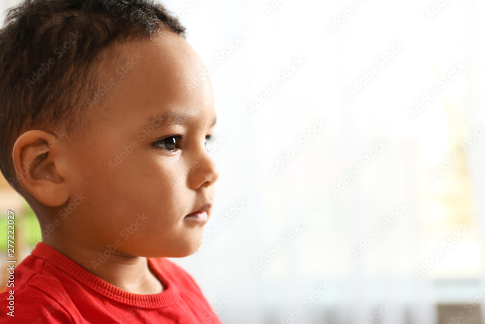 Cute little African-American child in kindergarten, space for text Cute little African-American child in kindergarten, space for text