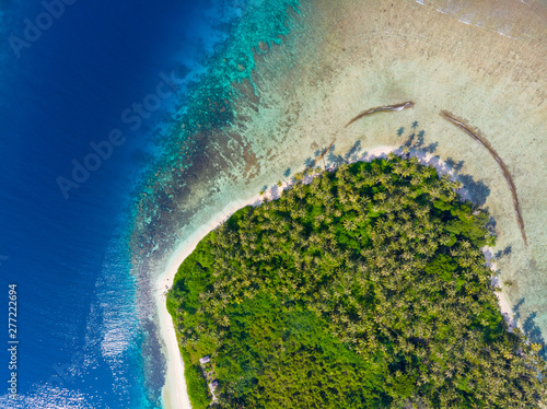 Aerial top down tropical archipelago Indonesia, coral reef white sand beach beach turquoise water. Travel destination, uncontaminated ecosystem