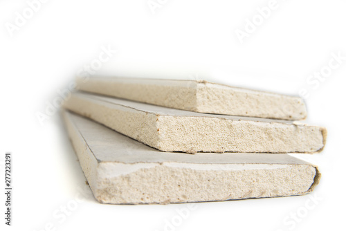 Stacking of white gypsum panels, drywall or plasterboard