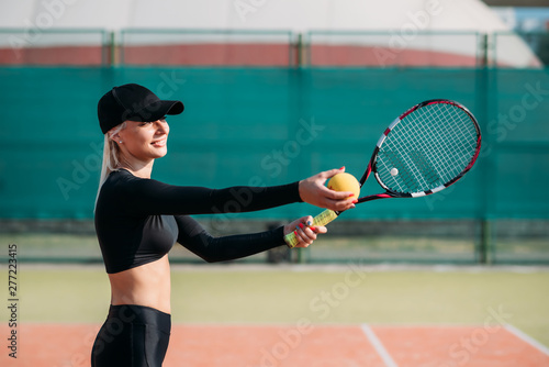 Young beautiful woman playing tennis on a court. Healthy sport lifestyle © Lazy_Bear