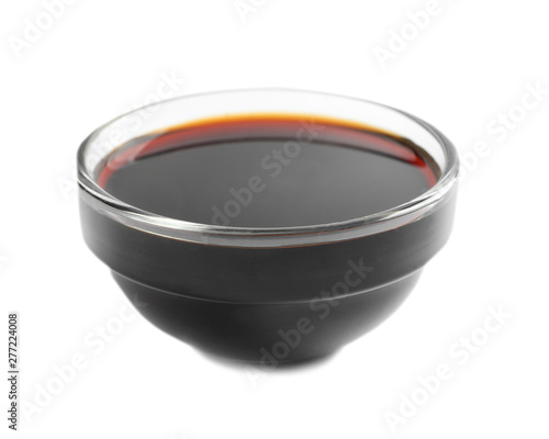 Traditional soy sauce in bowl on white background
