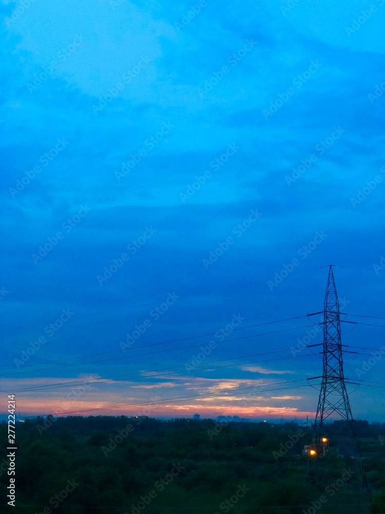 electricity pylons at sunset electricity pylons at sunset