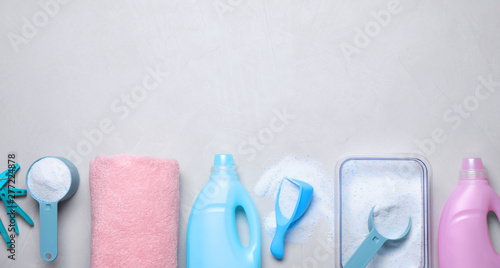 Tableau sur toile Flat lay composition with laundry detergent on light background, space for text