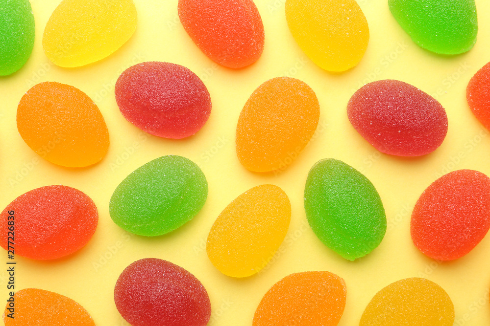 Tasty bright jelly candies on color background, flat lay Tasty bright jelly candies on color background, flat lay