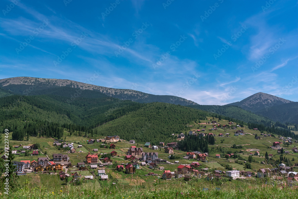Beautiful summer landscape wint mountains. Carpatian village at mountains