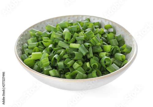 Bowl of cut green onion on white background