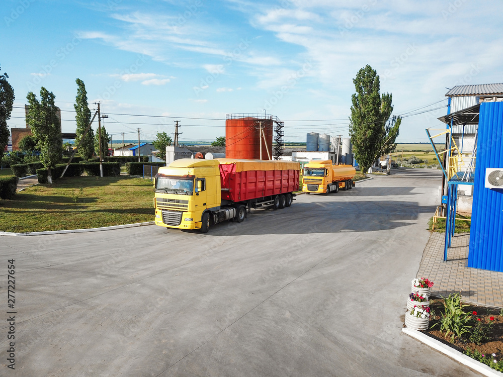 Modern bright trucks parked on country road Modern bright trucks parked on country road