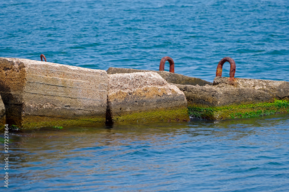 Fototapeta premium big breakwater on the sea