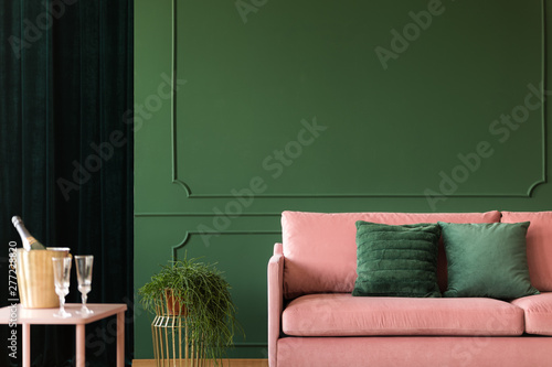 Bottle green wall with decorative wall moldings photo