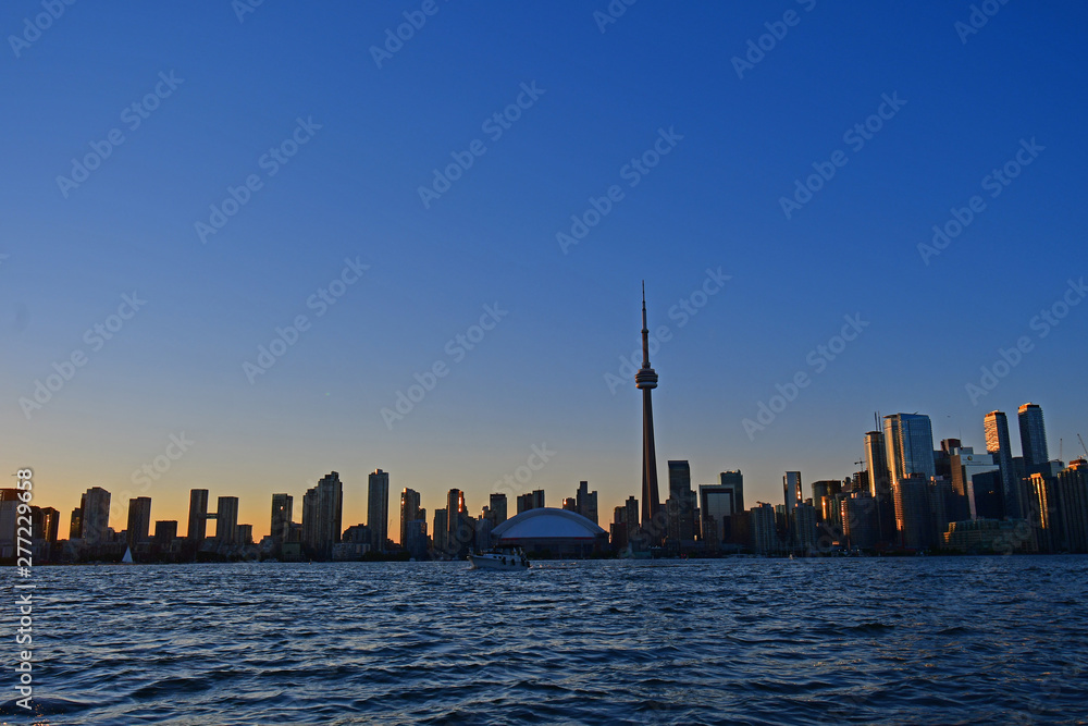 Skyline of Toronto, Canada as seen from the harbor on a summer evening