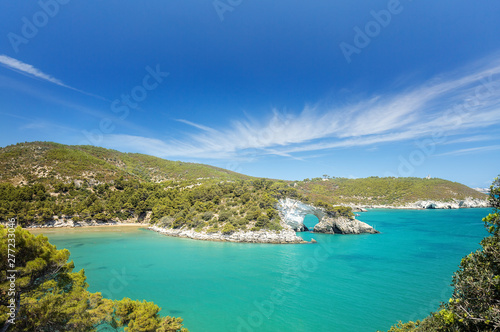 Italian touristic destination in Puglia - San Felice arch rock bay - Natural park Gargano with beautifulturquoise sea. Apulia, Southern Italy, Europe