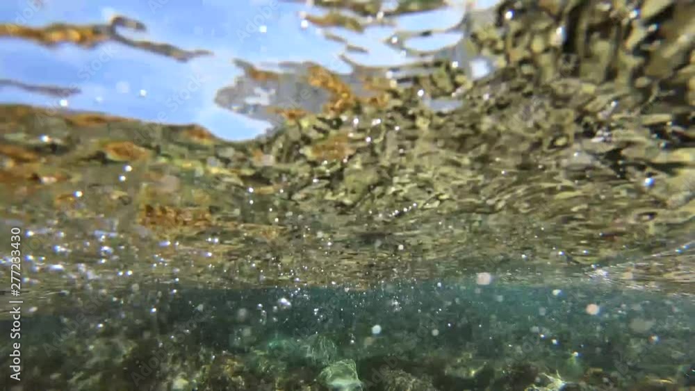 View from the surface of the sea on the waves, the bottom and the rocks. View from the surface of the sea on the waves, the bottom and the rocks.