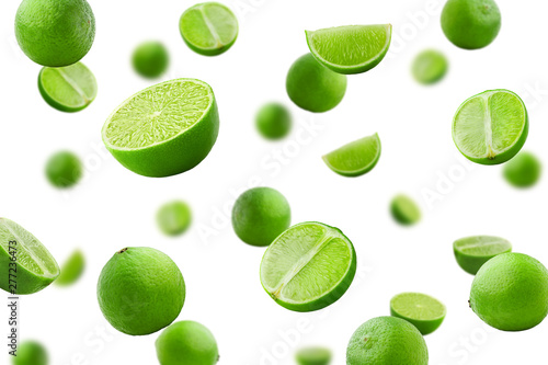 Falling lime isolated on white background, selective focus