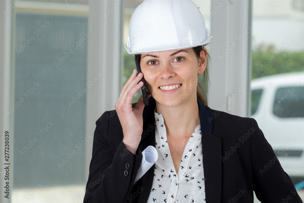 portrait of a happy woman engineer on the phone portrait of a happy woman engineer on the phone