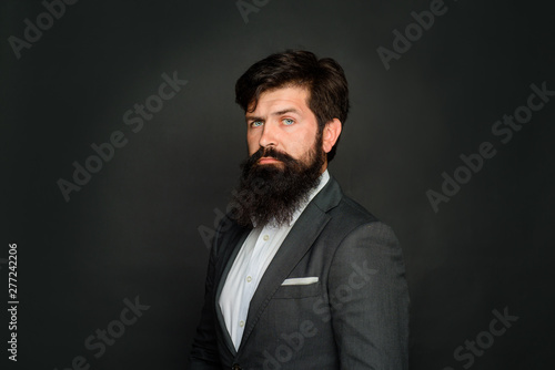 Thoughtful handsome male. Attractive bearded man in suit. Concentrated bearded man thinking about something. Successful businessman. Bearded man portrait. Handsome stylish man. Bearded male portrait.