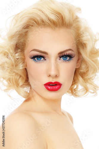 Vintage style portrait of young beautiful sexy girl with blonde curly hair and red lipstick
