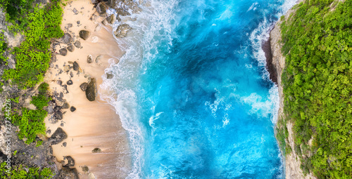 Aerial view at sea, beach, rocks. Turquoise water background from top view. Summer seascape from air. Summer adventure. Travel - image © biletskiyevgeniy.com