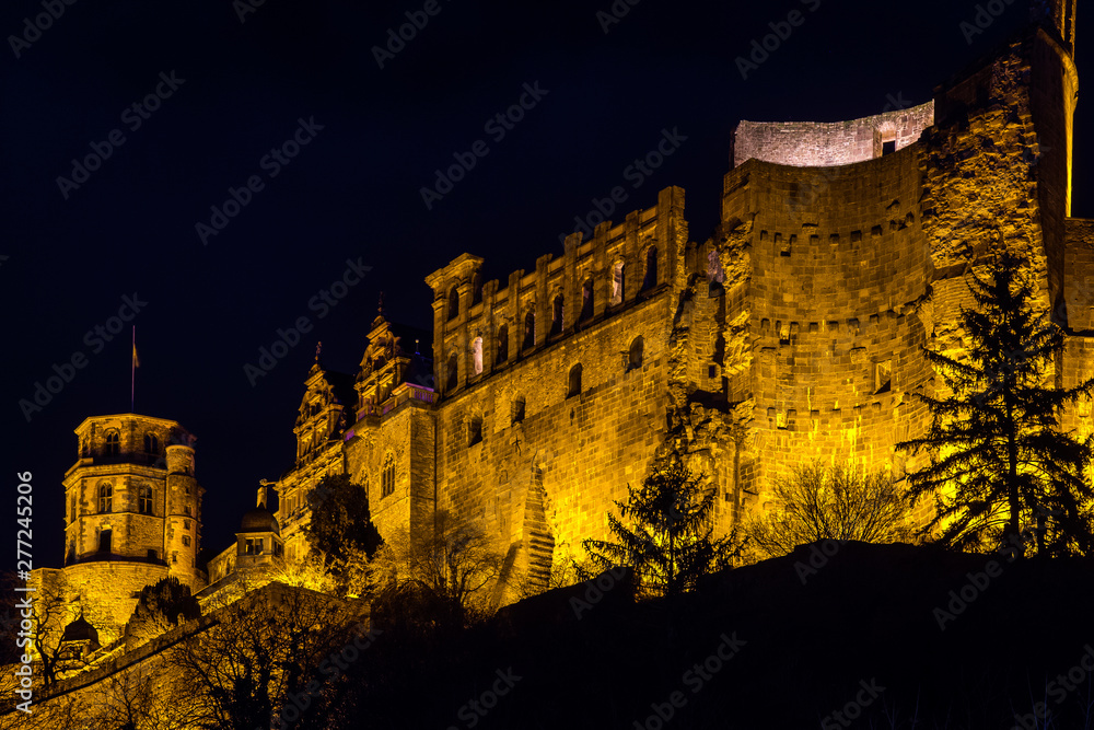 old heidelberg castle on hilltop at night