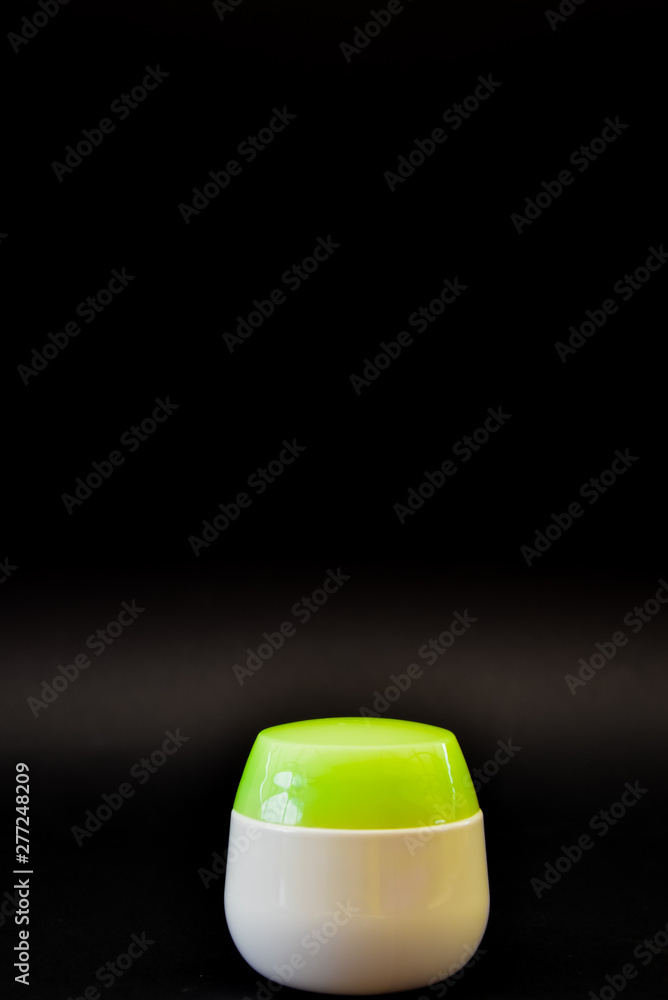 A bottle of household chemicals cosmetics on a black background neck of a bottle close up macro pattern A bottle of household chemicals cosmetics on a black background neck of a bottle close up macro pattern