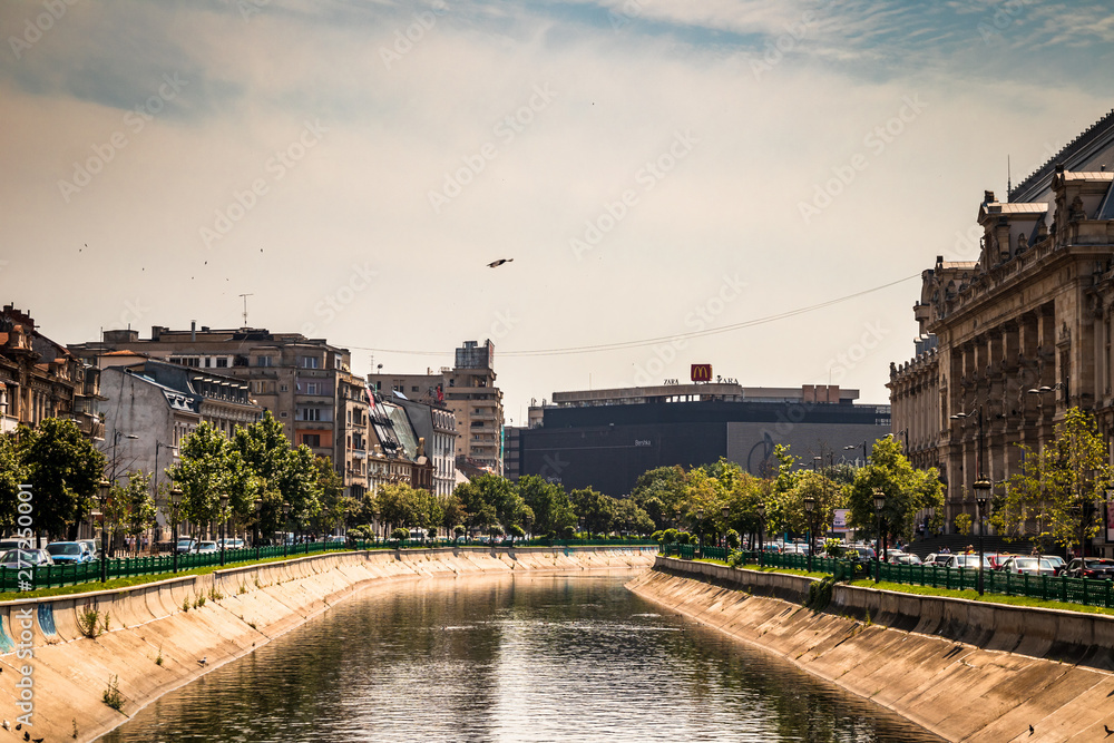 Buildings by the Dambovita river in Bucharest, capital of Romania.