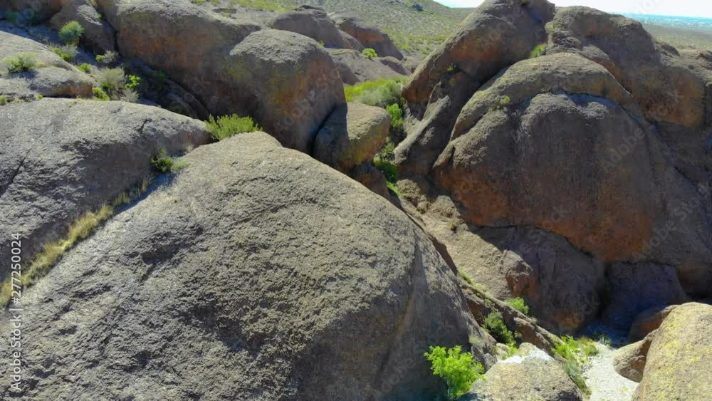 Mountain Rock Formation Aerial. aerial view moving over a rock formation in the middle of southwest desert scene Mountain Rock Formation Aerial. aerial view moving over a rock formation in the middle of southwest desert scene