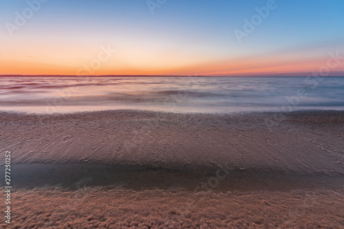 early morning sunrise on a choppy river / wind early spring landscape