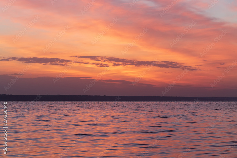 early morning sunrise on a choppy river / wind early spring landscape