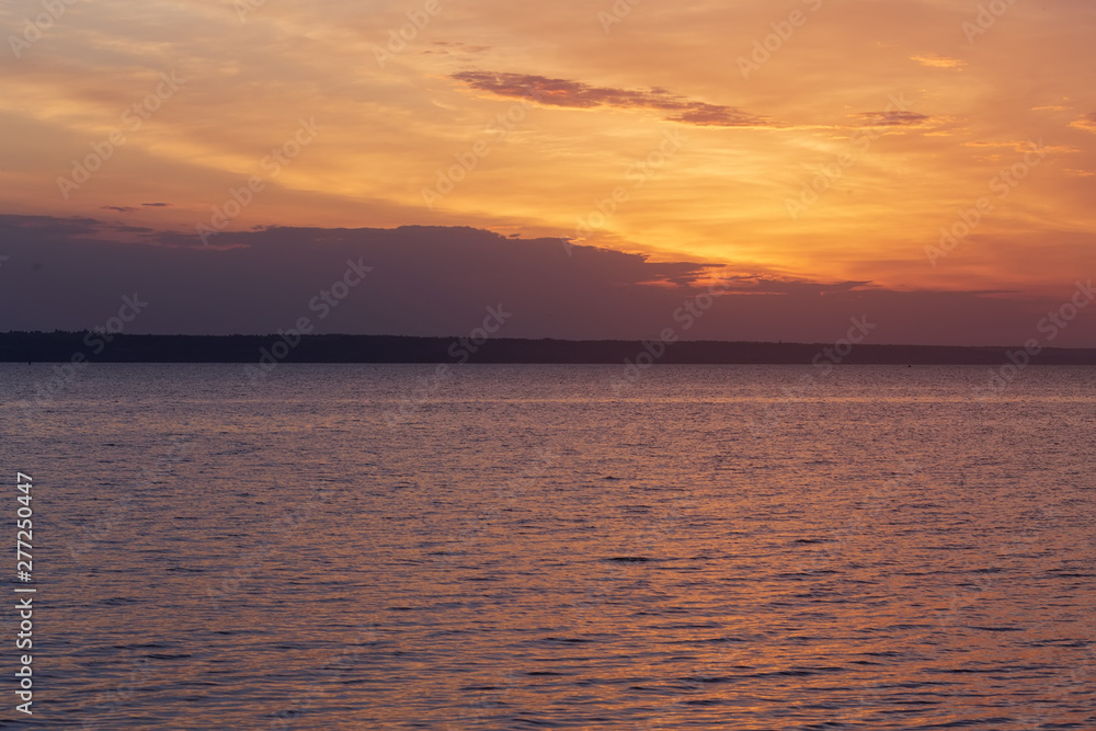 early morning sunrise on a choppy river / wind early spring landscape